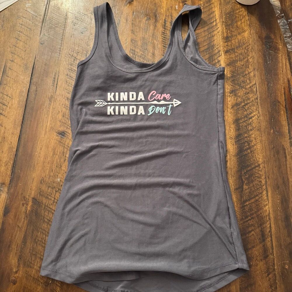 Soft charcoal gray racerback tank with cheeky “Kinda Care, Kinda Don’t